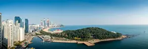 Aerial view panorama of skyscrapers and Haeundae beach with beautiful sea in the summer of Busan, South Korea. Busan tourism, modern city life, or bus