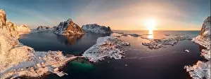 Aerial view, Panorama, Sunrise on Lofoten island is archipelago with fishing village on coastline in winter at Norway