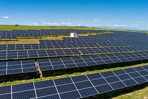 Solar Panels Prints: Aerial view photovoltaic panels park on green field in north Greece