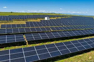 Solar Panels Prints: Aerial view photovoltaic panels park on green field in north Greece