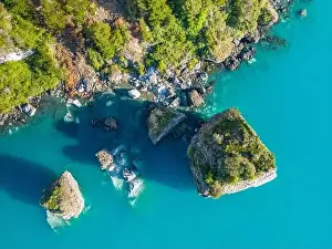 Rocky Shoreline Prints: Aerial view of the picturesque Marble Caves near Puerto Rio Tranquilo - Lago General Carrera