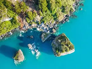 Rocky Shoreline Prints: Aerial view of the picturesque Marble Caves near Puerto Rio Tranquilo - Lago General Carrera