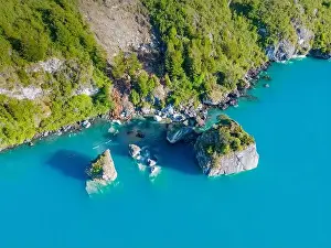 Rocky Shoreline Prints: Aerial view of the picturesque Marble Caves near Puerto Rio Tranquilo - Lago General Carrera