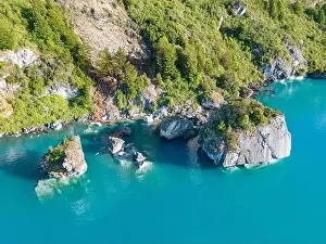 Rocky Shoreline Prints: Aerial view of the picturesque Marble Caves near Puerto Rio Tranquilo - Lago General Carrera