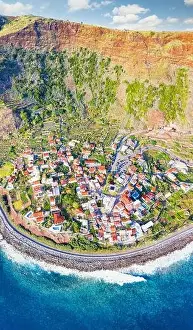 Madeira Island Prints: Aerial view of the picturesque seaside town of Jardim do Mar at feet of majestic mountain