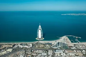 Burj Prints: Aerial view from a plane of Dubai Jumeirah district cityscape on a sunny day