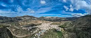White Mountain Prints: aerial view of the pretty white village of Alfarnate in the province of Malaga, Spain
