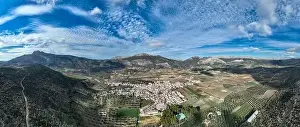 White Mountain Prints: aerial view of the pretty white village of Alfarnate in the province of Malaga, Spain