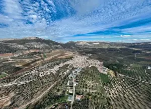 White Mountain Prints: aerial view of the pretty white village of Alfarnate in the province of Malaga, Spain