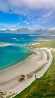 Lofoten Prints: An aerial view of a pristine white sand beach curving along a green coastline