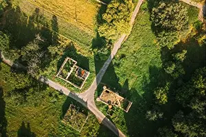 Aerial View Remains Of Yastrzhembsky Estate And Park Complex. Top View Of Old Five-storey Brick Water Tower. Drone View Of Beautiful European Nature