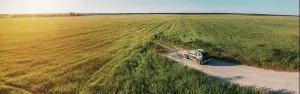 Crossover Prints: Aerial view of Renault Duster car SUV parked near countryside ro