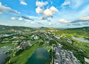 Aerial view of residential houses and driveways neighborhood during in sunny time