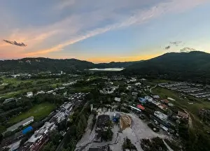 Building Construction Prints: Aerial view of residential houses and driveways neighborhood during in sunset time