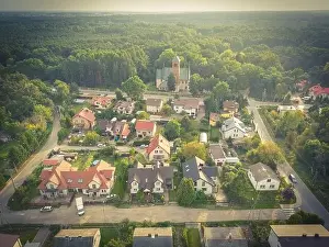 Parking Lots Prints: Aerial view of residential houses neighborhood and apartment building complex at sunset