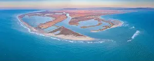 Golden Light Prints: Aerial view of the river mouth in the Ebro Delta at sunrise (Tarragona)