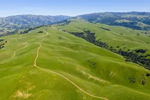 East Bay Prints: An aerial view of rolling hills in Northern California's tri-valley region shows lush