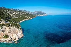 Mediterranenan Sea Prints: Aerial view of the rugged mountainous coast near Cala Gonone with turqouise water and small white sand beaches