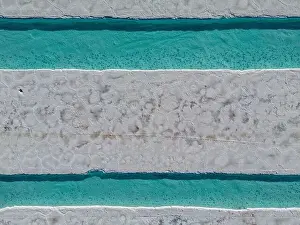 Aerial view of the salt basins in the salt crust of the huge salt flats Salinas Grandes de Jujuy in northern Argentina