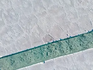 Aerial view of the salt basins in the salt crust of the huge salt flats Salinas Grandes de Jujuy in northern Argentina