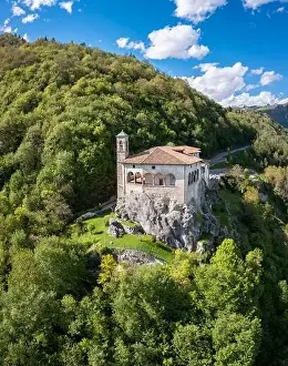 Seriana Valley Prints: Aerial view of the San Patrizio sanctuary on a hill overlooking Casnigo and Valle Seriana