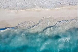 Images Dated 22nd May 2019: Aerial view of sandy beach and ocean with waves. Beautiful tropical white empty beach