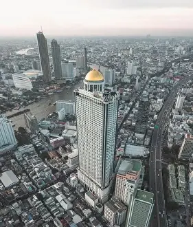 Sathorn Prints: Aerial view of Saphan Taksin district near the Taksin bridge and Chao Phraya river
