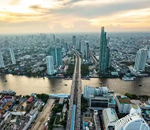 Sathorn Prints: Aerial view of Saphan Taksin district near the Taksin bridge and Chao Phraya river