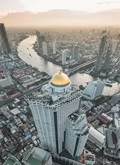 Sathorn Prints: Aerial view of Saphan Taksin district near the Taksin bridge and Chao Phraya river