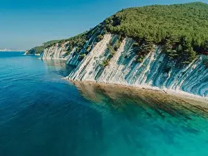 Adriatic Sea Prints: Aerial view of scenic coastline with blue sea and rocky cliffs with pine forest