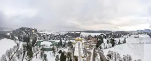 Aerial view of Schloss Hellbrunn covered in snow near Salzburg outskirts in winter time