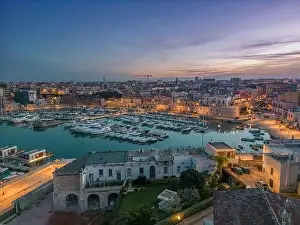 Ancient Town Prints: Aerial view of seafront and old town Bisceglie in Puglia with drone on sunset