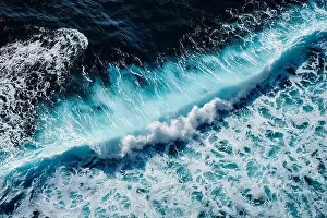 Turbulence Prints: Aerial view to seething waves with foam