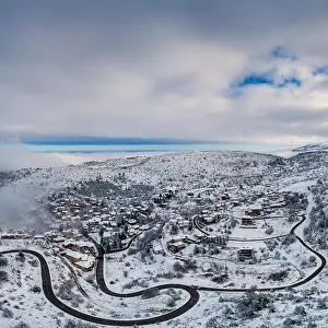 Aerial View of Seli Traditional Greek Village Covered by Snow in Winter Morning