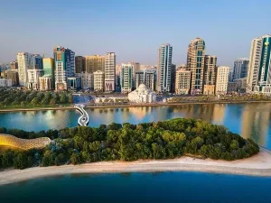 Sharjah Prints: Aerial view of Sharjah Emirate of the United Arab Emirates above Al Noor island and mosque