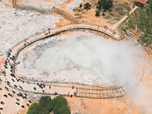 Central Java Prints: Aerial view of Sikidang crater with the background of sulfur vapor coming out of the sulfur marsh