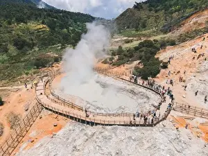 Central Java Prints: Aerial view of Sikidang crater with the background of sulfur vapor coming out of the sulfur marsh