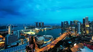 Ferris Prints: Aerial view of Singapore business district and city at night in Singapore, Asia