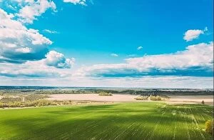 Aerial Landscape Collection: Aerial View. Sky With Clouds Above Countryside Rural Field Landscape In Spring Summer Cloudy Day