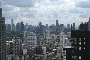 Sukhumvit Prints: Aerial view of the skyline of Thai capital on a summer day with clouds