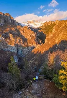 Seriana Valley Prints: Aerial view of the small church called San Peder and the Presolana during a winter sunset