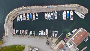Transportation System Prints: Aerial view of a small coastal village featuring a harbor