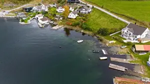 Transportation System Prints: Aerial view of a small coastal village featuring a harbor