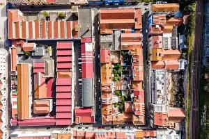 Slum Prints: Aerial view of a small residential district in Lisbon outskirt along a railway