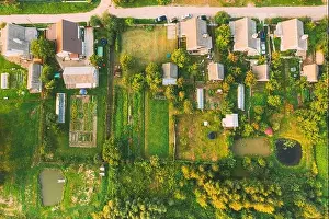 Garden Bed Prints: Aerial View Of Small Town Cityscape Skyline In Summer Day