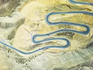 Serpentine Prints: Top aerial view of snake curved road