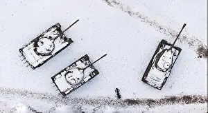 Aerial view of snow-clad tanks in Pozna