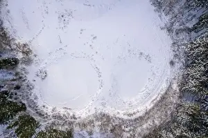 Frozen Lake Prints: Aerial view of snow covered forest around beautiful lake