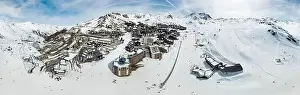 Accomodation Prints: Aerial view of the snowy Val Thorens ski resort in the French Alps in winter - Luxurious hotels secluded in a white