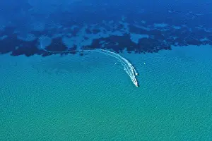 Aerial view of speed boat in motion. Water transportation and summer leisure time activity